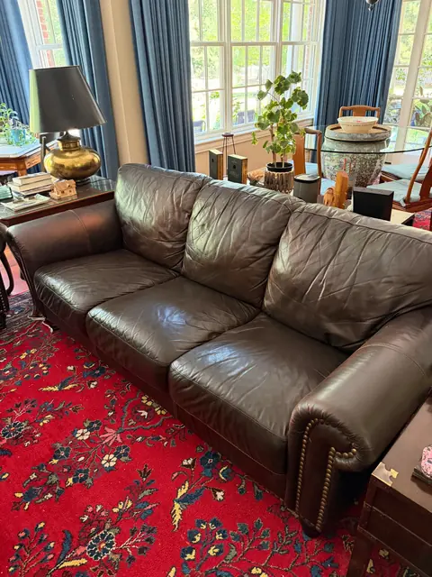 Leather sofa seat cushions after professional recoloring in Denver